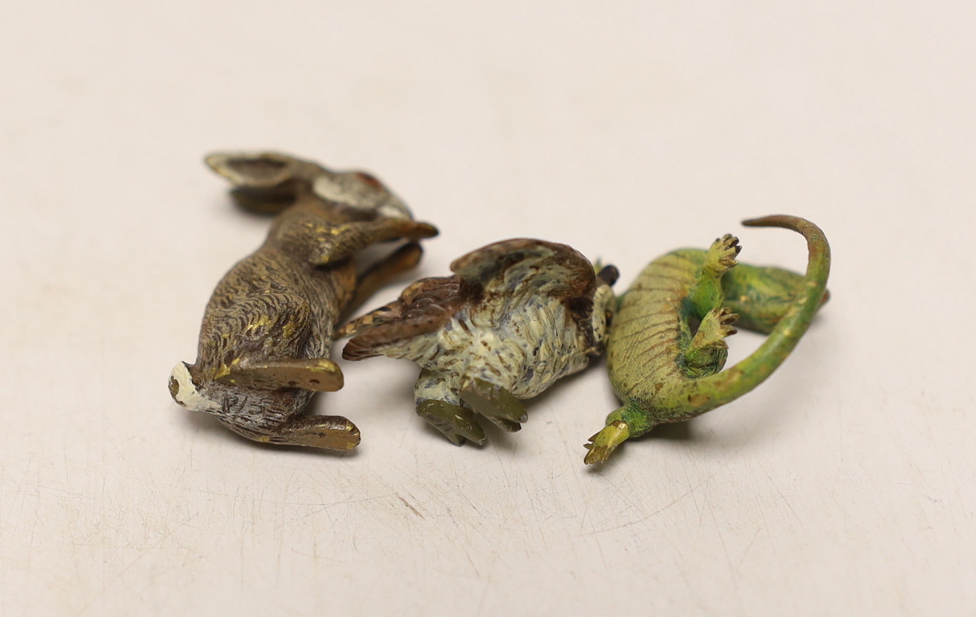 Three Austrian cold painted bronze models of a hare, a lizard and an owl, largest 3.5cm high